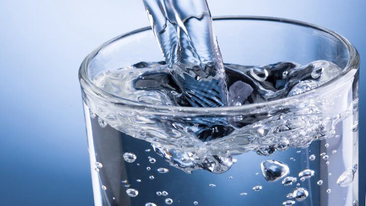 Water pouring into a glass
